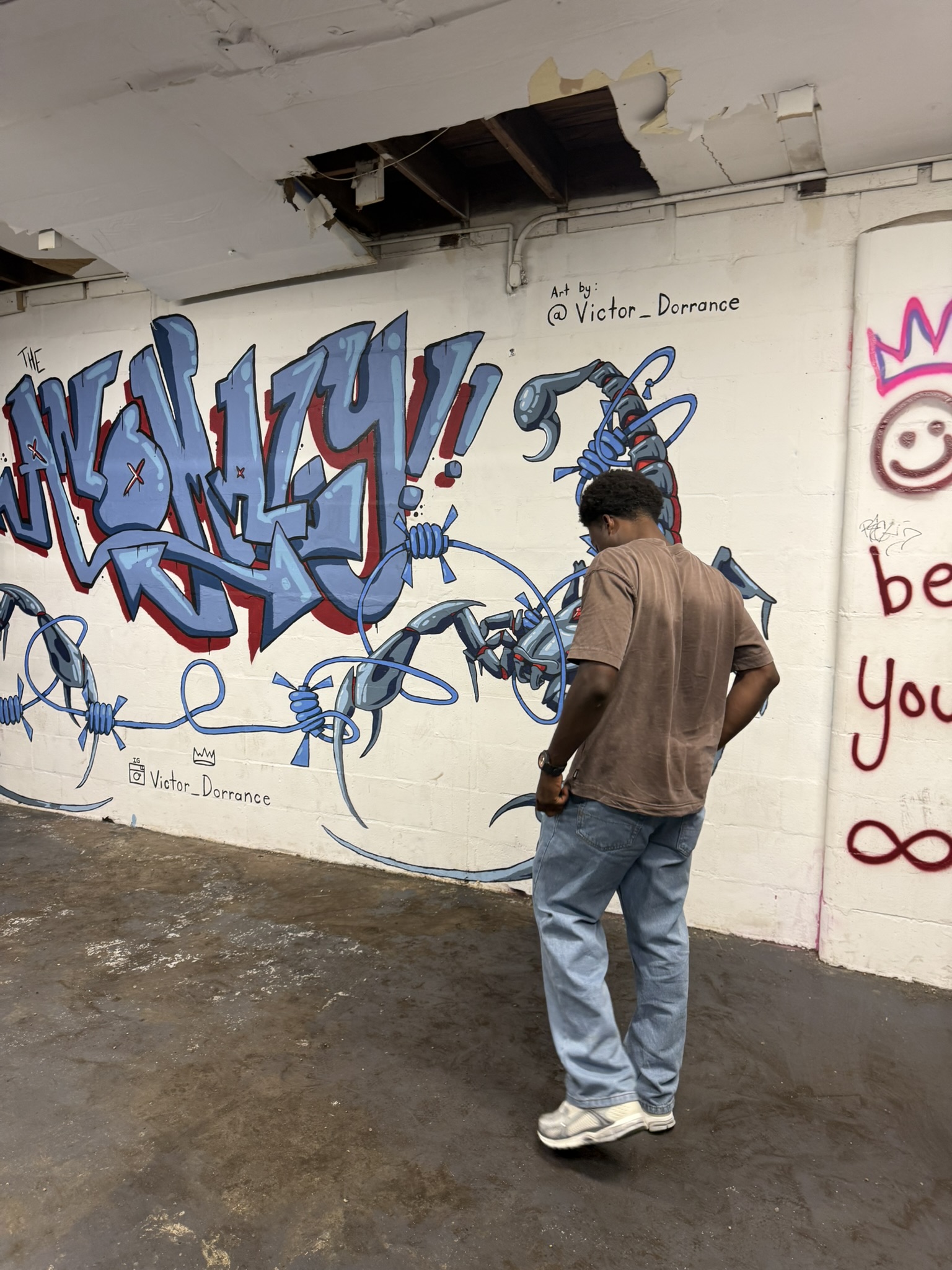 Vintage thrift store with a blue and red graffiti mural in St. Petersburg Florida